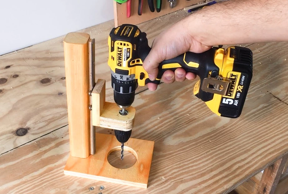 a wooden portable drill press