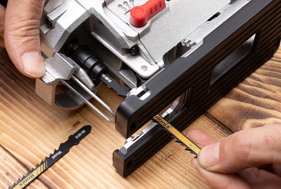 A jigsaw blade being installed