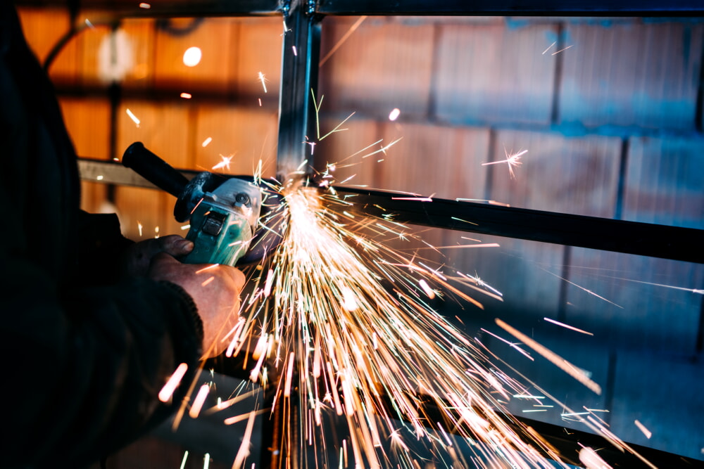 Man grinding metal